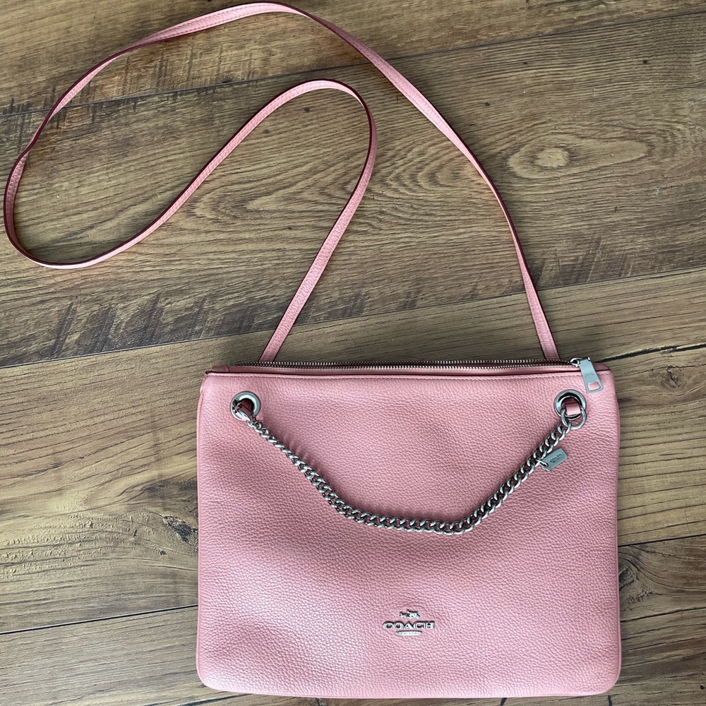 Gently used blush pink leather Coach crossbody bag with silver chain.